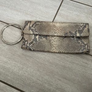 Kate Spade gold and silver snakeskin wristlet